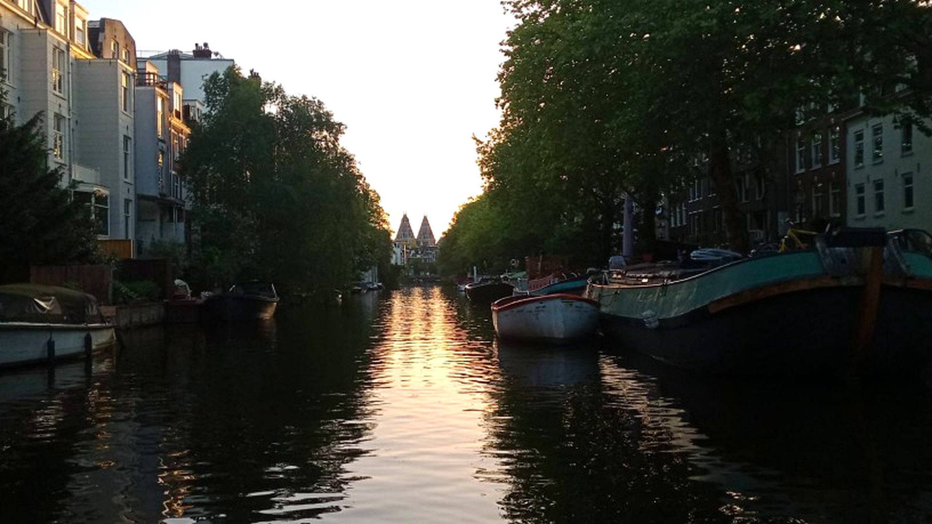 Canal boat cruising through Amsterdam